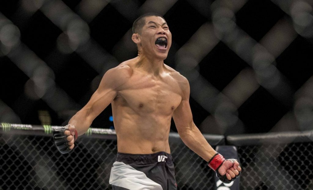 Jingliang Li celebrates after a UFC victory