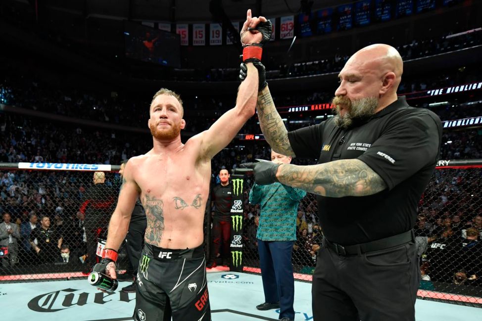 Justin Gaethje has his hand raised by MMA referee Mike Beltran following a UFC victory. The Unified Rules of MMA outline scoring criteria.