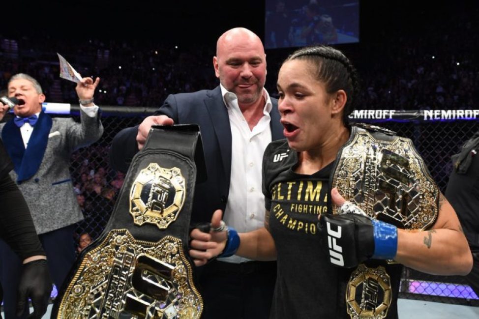 Amanda Nunes receives the featherweight title after knocking out Cris Cyborg