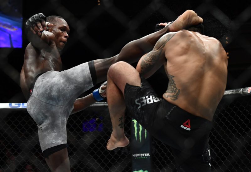 Israel Adesanya lands a right high kick against Brad Tavares at UFC 234